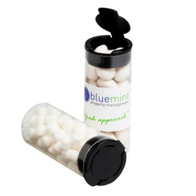 A clear flip lid tube containing white mints, with a black cap and a logo on the side.