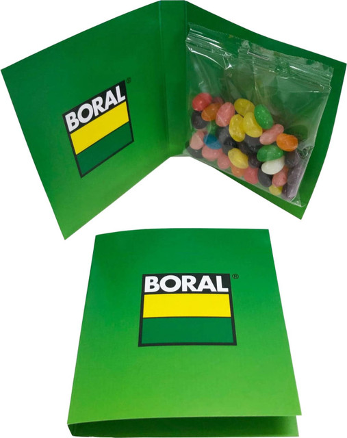 A green gift card holding a clear bag of colourful jelly beans, featuring a logo on the front cover.