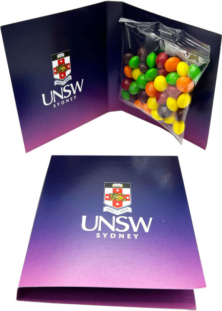 A gift card featuring a 50g bag of mixed Skittles in various colours, packaged in a decorative purple card with a logo.