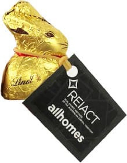 A 10g gold chocolate bunny with a tag attached, featuring a shiny gold foil wrapper.