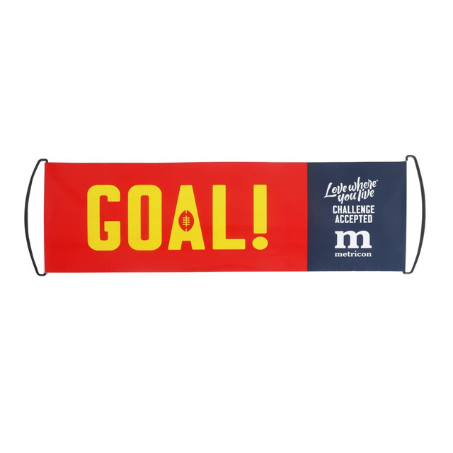 A hand-held fan flag featuring a red background with bold yellow text that reads "GOAL!" and a blue section with a logo.
