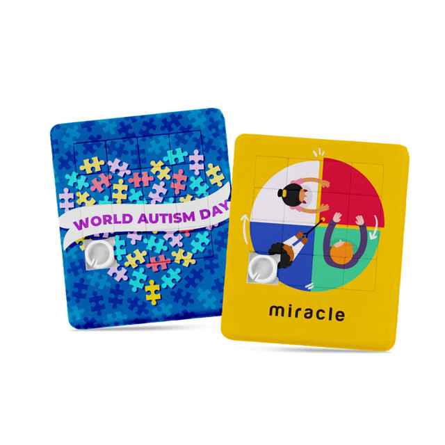 A vibrant sliding puzzle featuring colourful puzzle pieces and illustrations related to World Autism Day, with a branding logo.