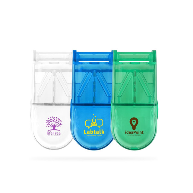 A pill box with a cutter in clear, blue, and green colours, featuring different logos on each.