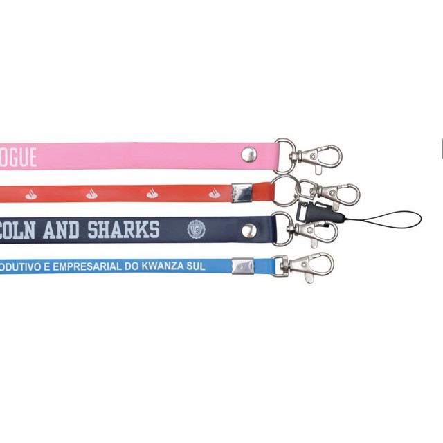 Four PVC lanyards in pink, red, navy, and light blue, featuring metal clips and one with a string attachment.
