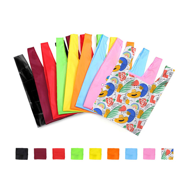 A variety of reusable foldaway shopping bags in multiple colours, including red, green, orange, and a patterned bag featuring tropical designs.