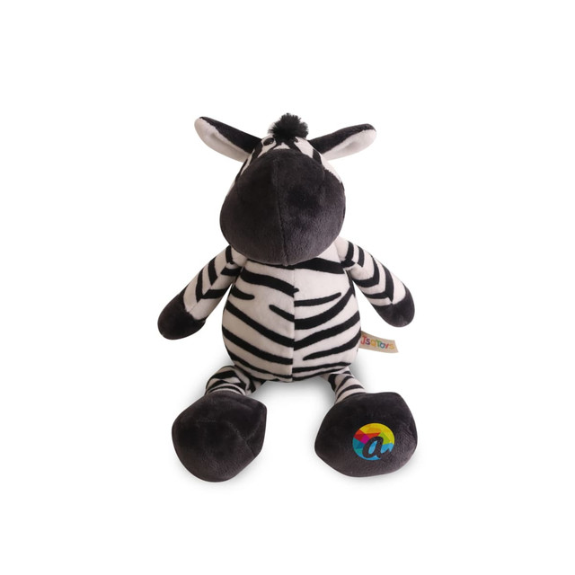 A plush zebra toy in black and white stripes with a soft, rounded body and a colourful logo on its foot.