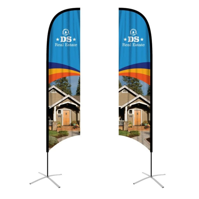 Concave feather banners in blue and black, featuring a logo and images of a house on a stand.