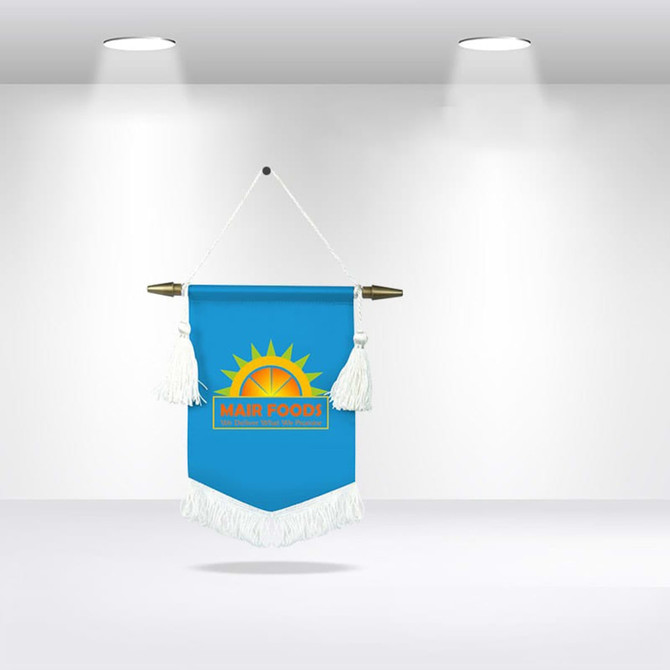 A blue podium flag with tassels and a gold sun graphic, featuring a logo at the centre, hanging in a display.
