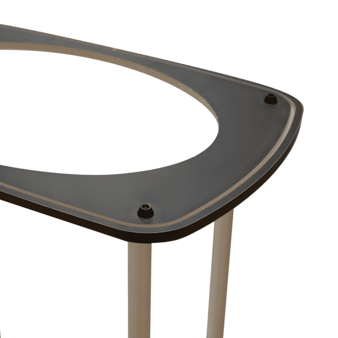 A black tabletop with a curved edge, supported by silver legs, featuring inset screws. It has a logo displayed.