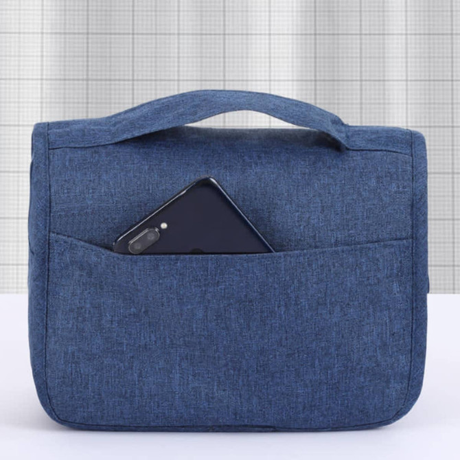 A blue travel hanging toiletry bag with a smartphone pocket on the front. It features a sturdy handle for easy carrying.