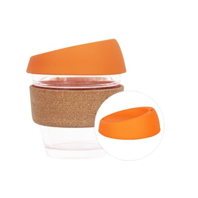 A reusable glass coffee cup with a cork band and an orange silicone lid. Features a branded logo.