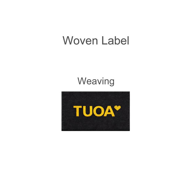A black woven label featuring the word "TUOA" in yellow lettering.