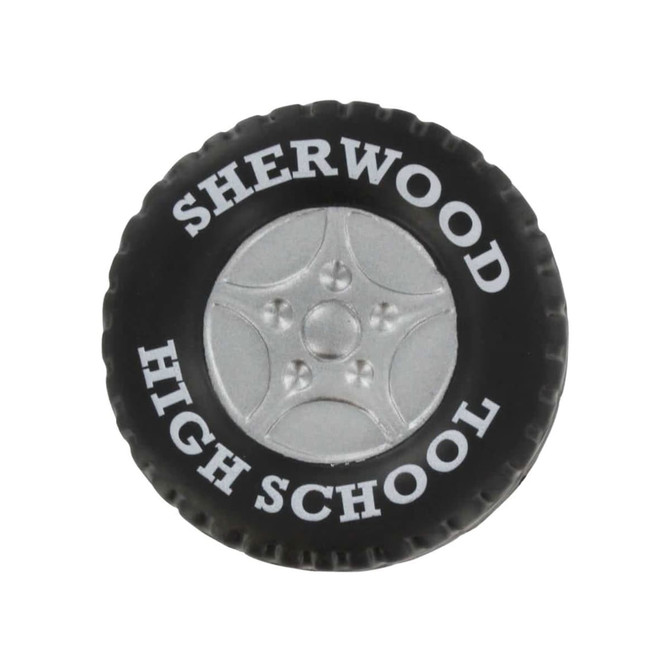 A black tire-shaped stress reliever featuring a silver wheel design and a logo.