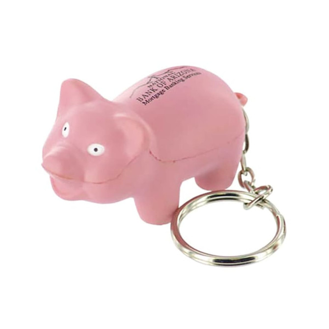 A pink mini pig stress item attached to a keyring, featuring a small keychain and white eyes.