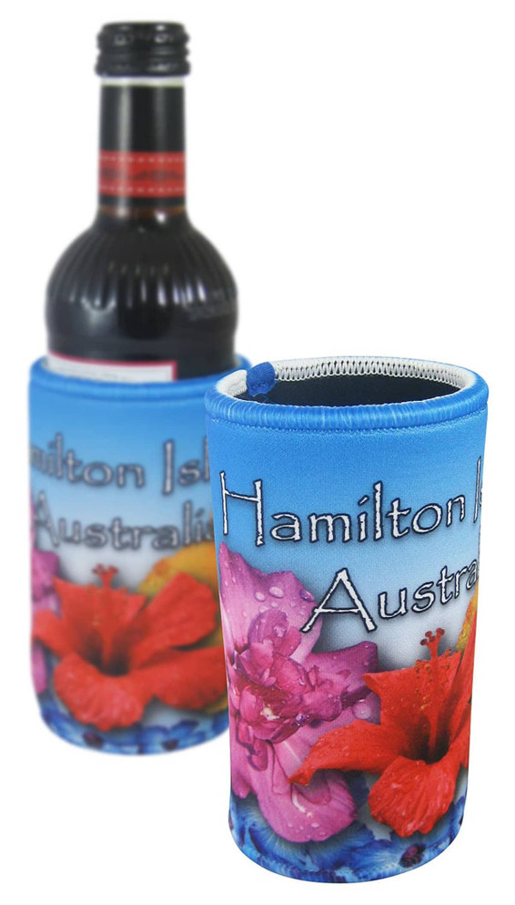 A drink bottle is wrapped in a colourful cooler featuring floral designs in shades of blue, pink, and red.