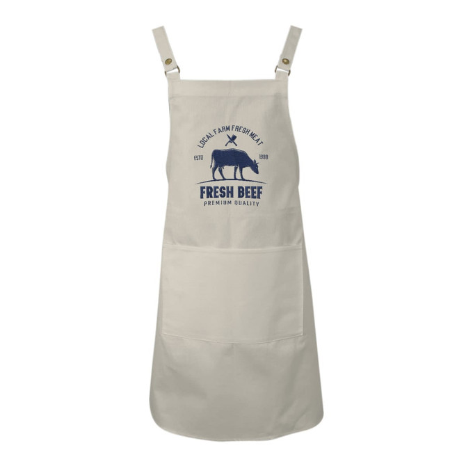 A cream bib apron with sewn-on straps and a logo featuring a cow graphic and text.
