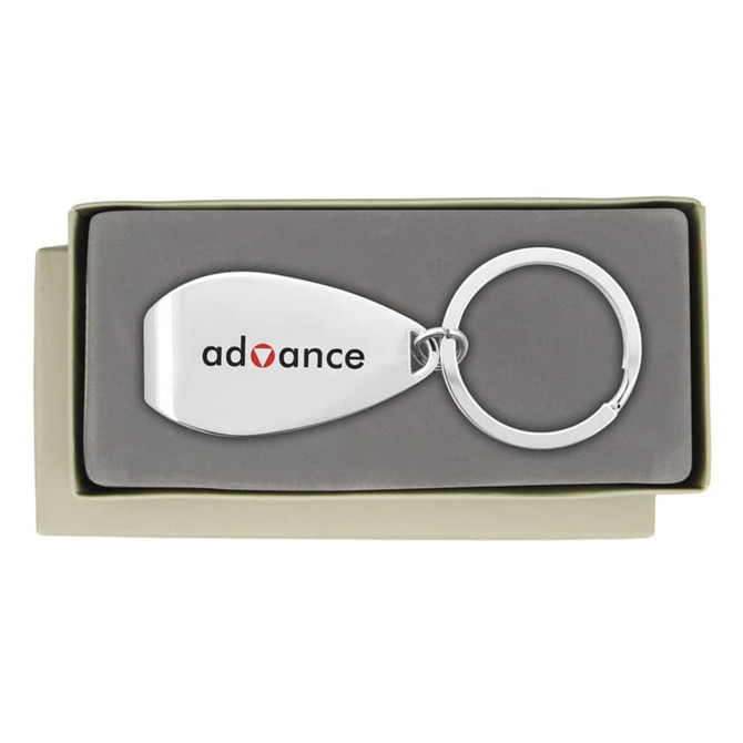 A silver keychain in a grey box, featuring a smooth, metallic surface and a circular ring.