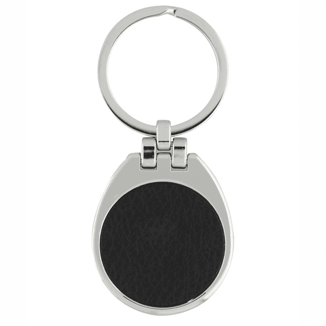 A silver keychain with a teardrop shape and a black textured surface.
