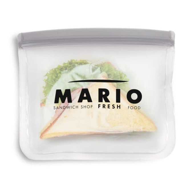 A PEVA reusable food storage bag in clear, featuring a sandwich inside and a logo on the front.