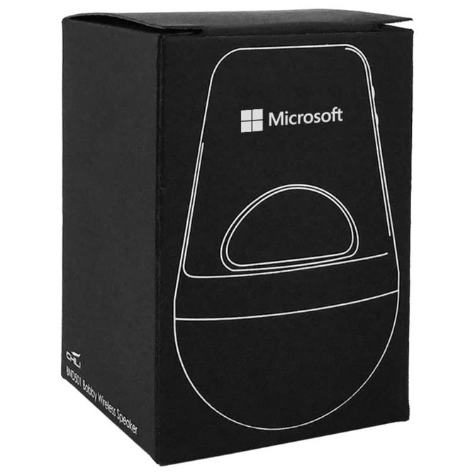 A sleek silver wireless speaker packaged in a black box with a logo. Features a minimalist design.