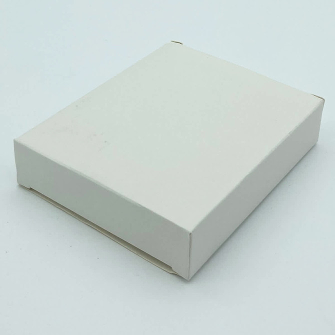 A plain white cardboard box, closed on a light background. No visible branding or markings.