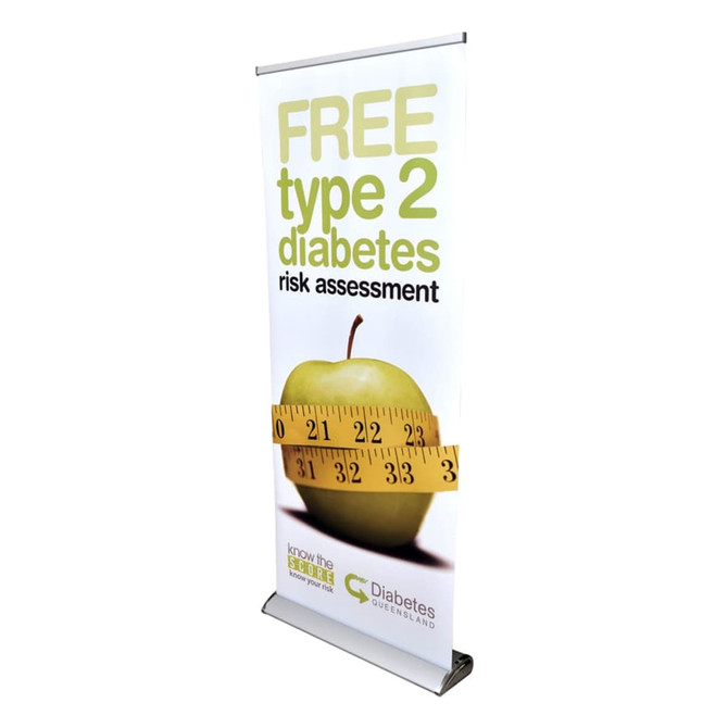 A roll-up banner featuring an apple and a measuring tape, predominantly in green and white, with a logo at the bottom.