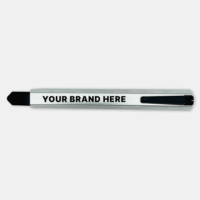 A slimline retractable box cutter in silver and black with a branding area.