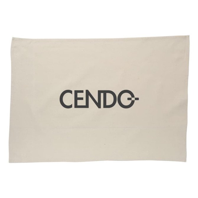 A cotton tea towel in a natural beige colour featuring a logo in a bold, modern font.