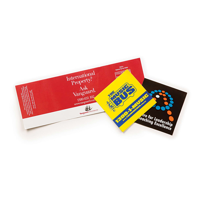 A collection of two vinyl stickers: a yellow and blue sticker with text, and a black sticker with a logo.