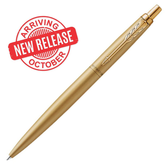 A gold ballpoint pen featuring a sleek design and a logo on the side.