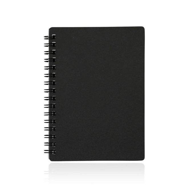 A black A6 spiral-bound notebook with a plain cover and visible spiral binding.