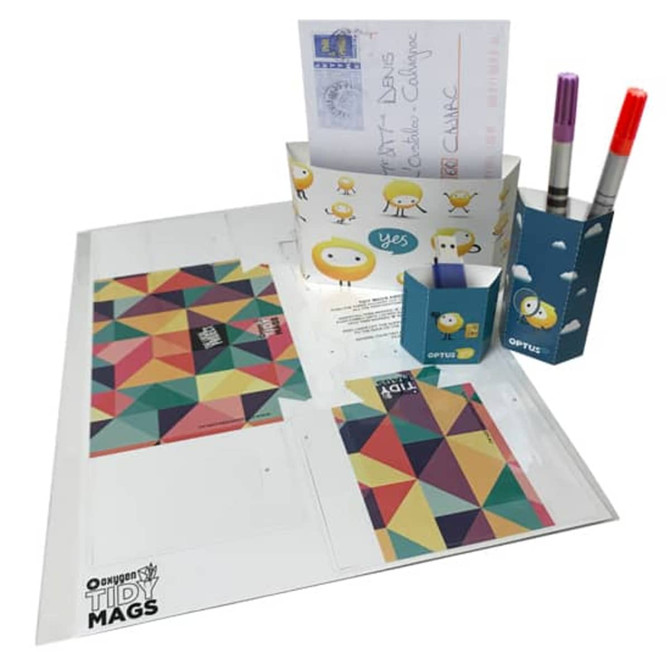Magnetic holders in various colours, including blue and geometric patterns, with compartments for notes and pens.