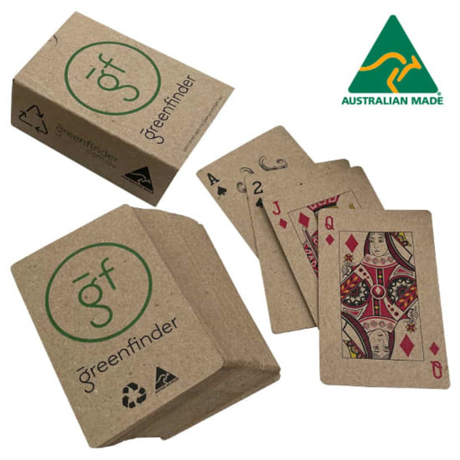 Eco Playing Cards in a kraft paper box, featuring a green logo, with cards displaying traditional designs in red and black.