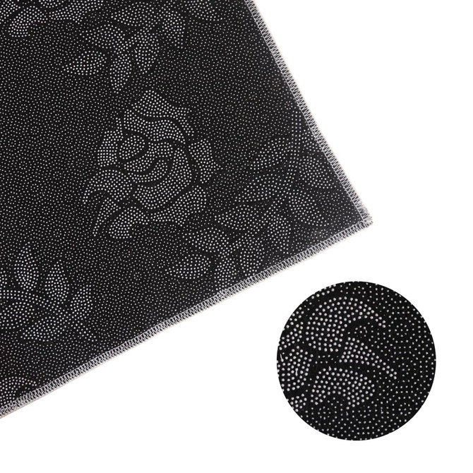 A black plush logo mat featuring a subtle rose pattern, bordered with a stitched edge. It includes a logo.