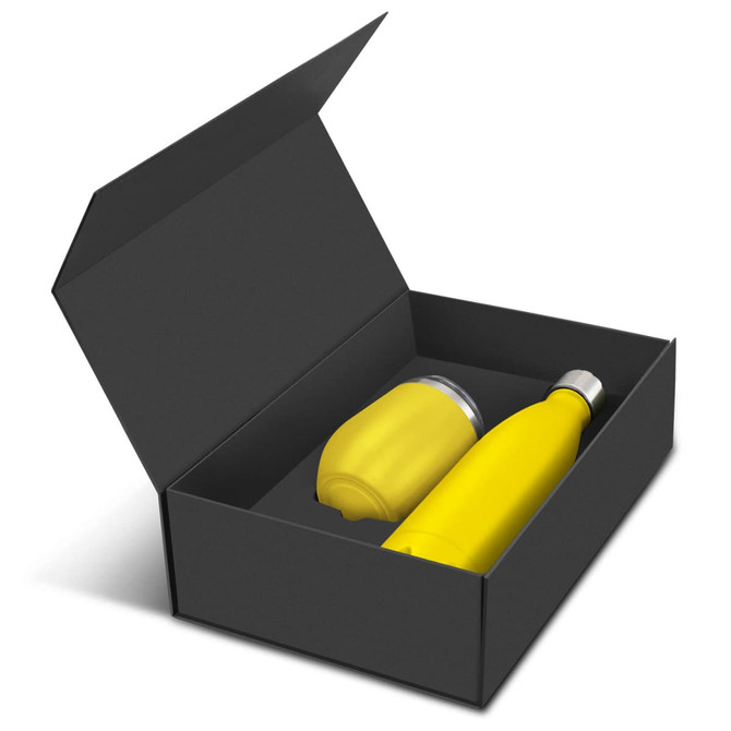 A yellow drink bottle and matching cup inside a black gift box, featuring a logo on the items.
