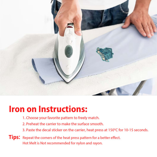 An iron is being used to apply a custom woven patch on light blue fabric. The patch features a logo.
