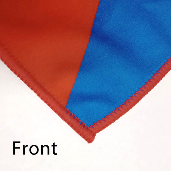 A close-up of custom polyester tea towels in vibrant red and blue with a stitched edge and a logo.