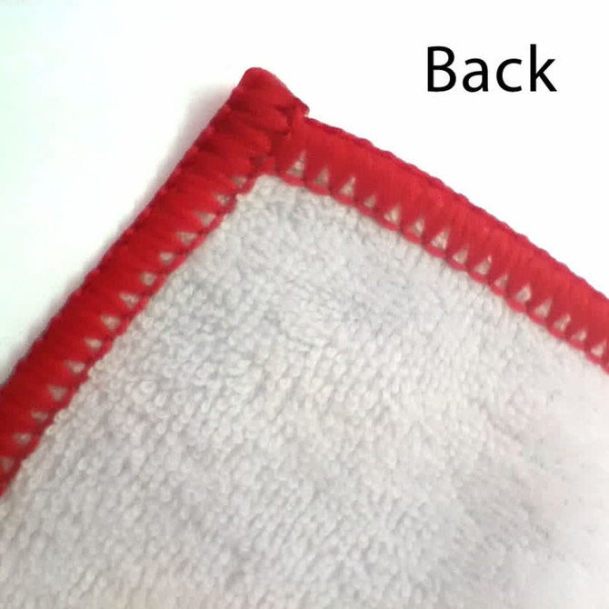 A close-up of a custom polyester tea towel with a red hem, showcasing the back texture.