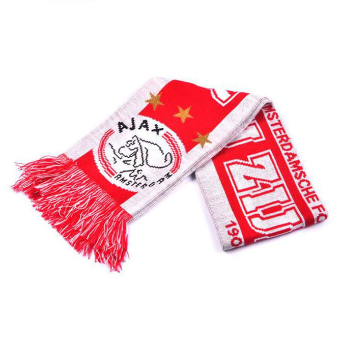 A red and white knitted scarf featuring a logo and fringe detailing. It has a sports team design.