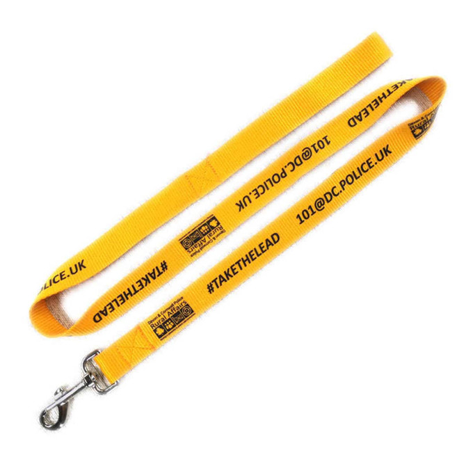 A yellow dog leash featuring a clip and printed text with a logo.