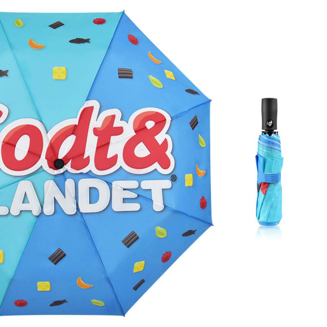 A compact umbrella featuring a blue canopy with colourful food-themed graphics and a black handle.