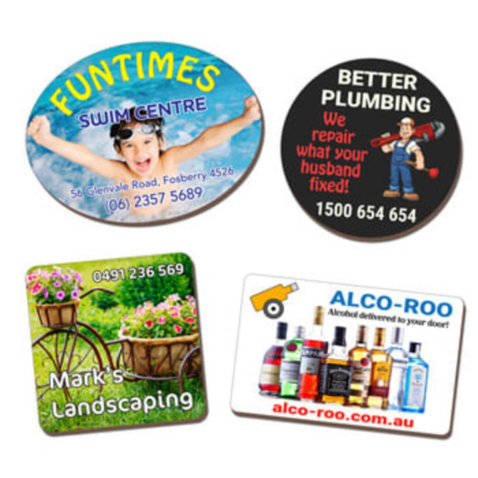 Four eco-friendly MDF magnets in various shapes featuring colourful designs and logos, with text and contact information.