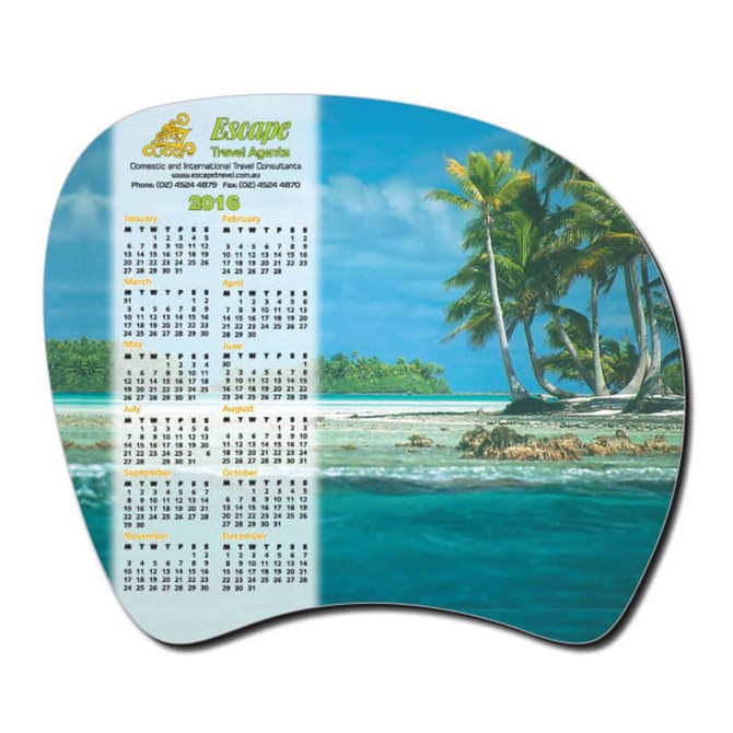 A promotional calendar mat featuring a beautiful tropical beach scene with palm trees, in vibrant colours.