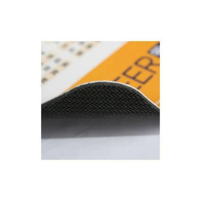 A textured mat featuring a black underside and an orange top surface, with a visible curved edge.