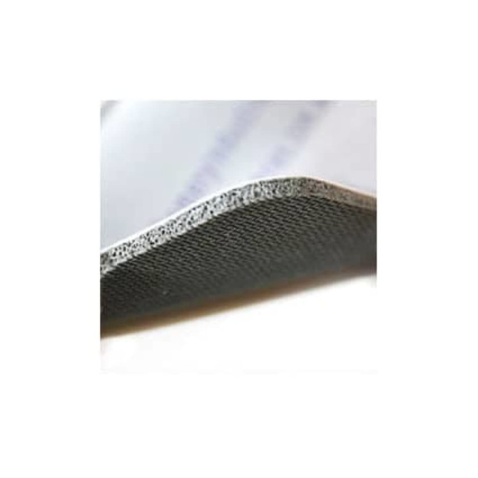 A close-up of a round black mat with a textured edge, showcasing its thickness and material.