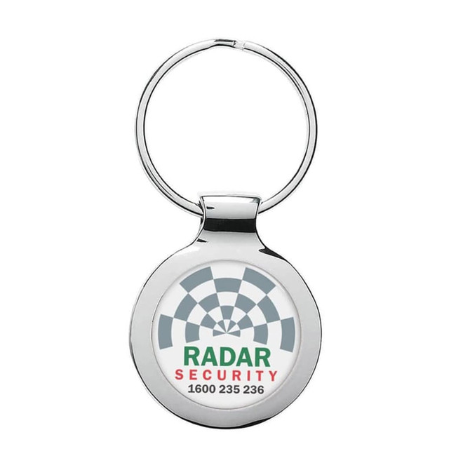 A silver metal keyring with a circular design and an embedded logo.
