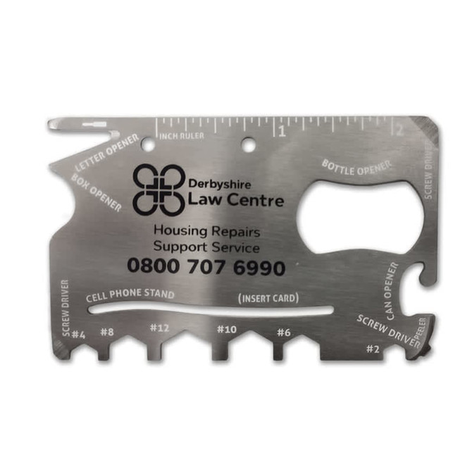 A silver multi-tool credit card size with various functions like a bottle opener and screwdrivers, featuring engravings and a logo.