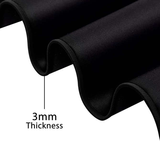 A close-up of a black rubber desk mat, highlighting its 3mm thickness and smooth texture.