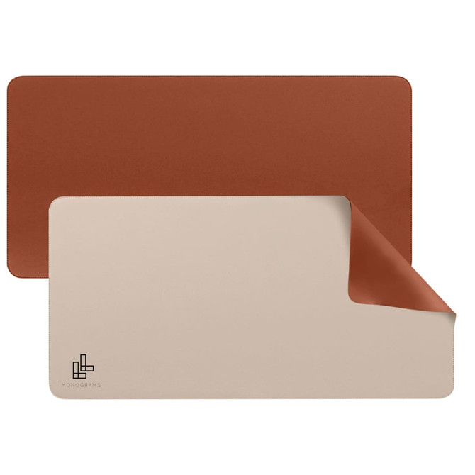 A PU leather desk mat featuring a brown and beige reversible design with a logo on one side.