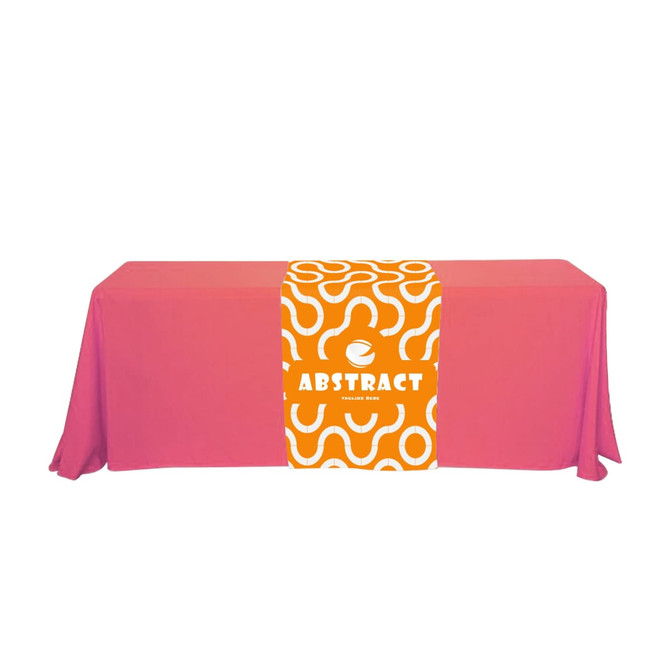 A large table runner in vibrant pink with an abstract orange and white design, featuring a logo at the centre.